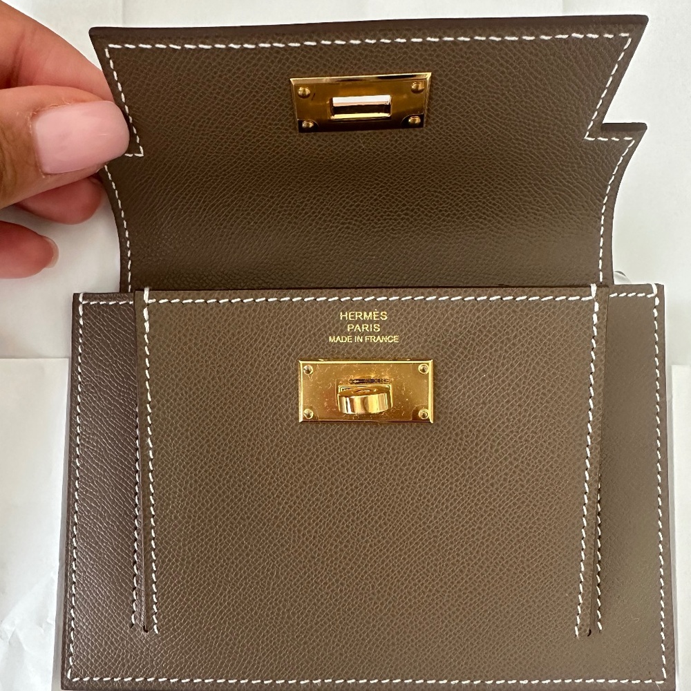 Hermes Kelly compact wallet in etoupe with gold hardware
